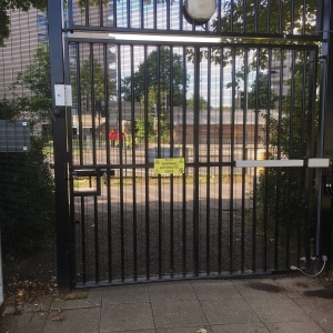 Automated pedestrian access gate with mesh